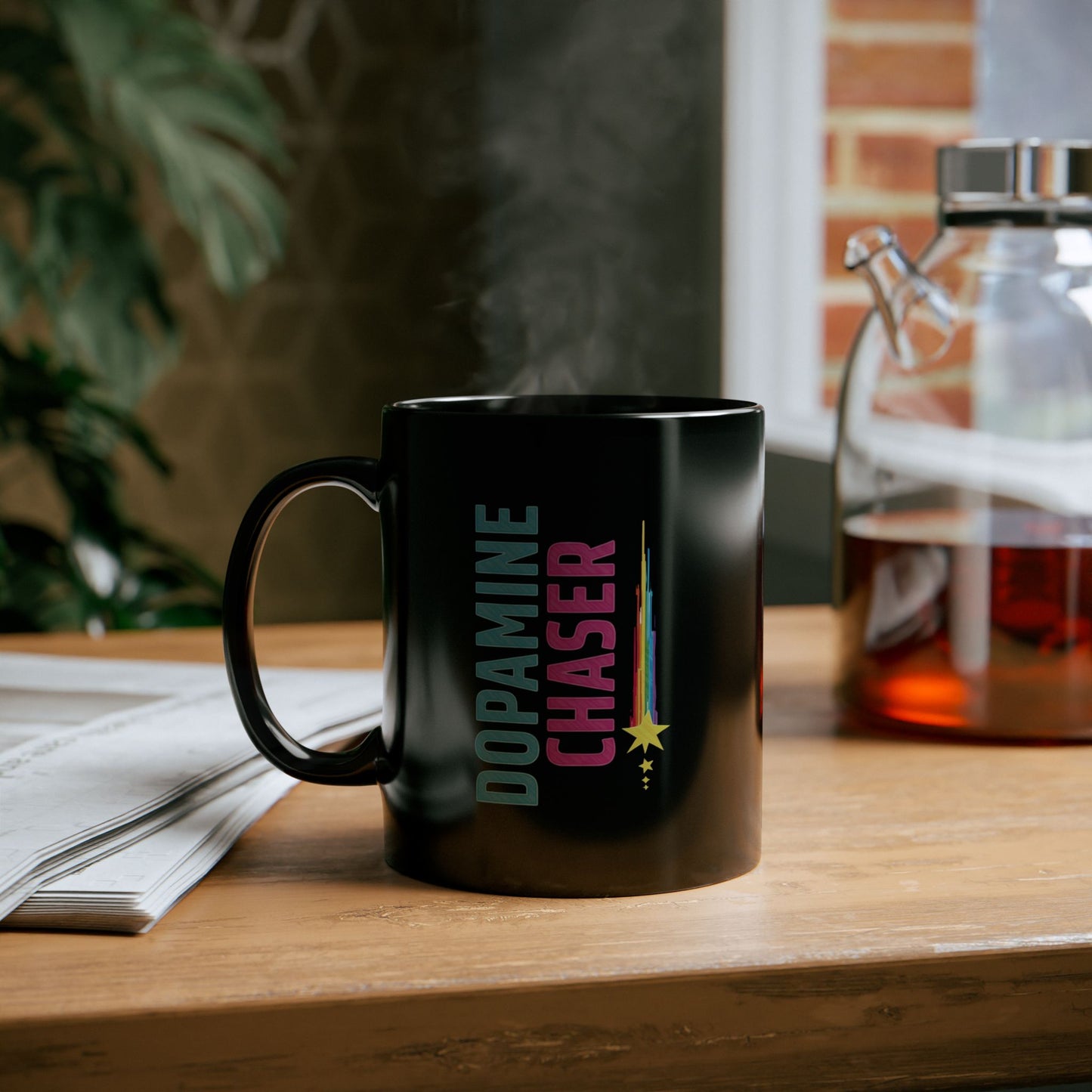 Black mug with 'Dopamine Chaser' text on a wooden surface with a blurred background