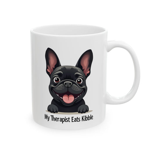 White mug with a black dog illustration and text 'My Therapist Eats Kibble' on a white background